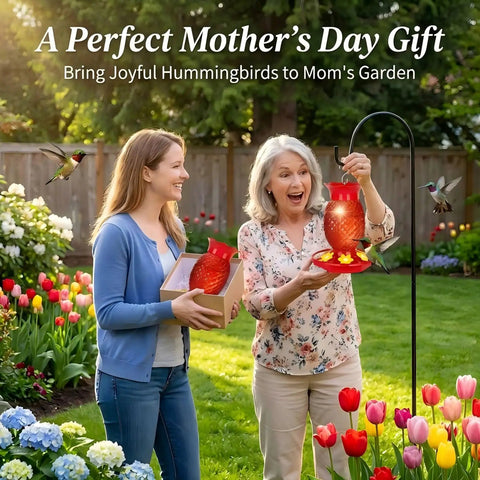 Two women in garden with red glass pineapple hummingbird feeder, 2-pack, 16 oz. Perfect Mother's Day gift idea.