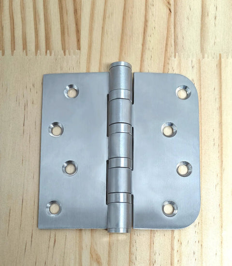 4x4 Inch Door Hinges With Ball Bearing, Built To Last, Stainless Steel, Brushed Nickel Finish, on wooden surface, 3 pack