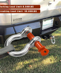 Heavy Duty Five Eighth Inch D Ring Shackles Three Point Two Five Ton Working Load Limit Clevis Shackle With Three Quarter Inch Alloy Screw Pin Two Pack For Off Road Jeep Trailer Towing Orange attached to vehicle hitch