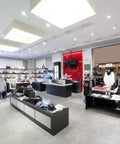LED Reflector Replacement Lamp 6.5R20 2700K Warm White, 525 Lumens, 120V, Dimmable lighting in a modern retail clothing store.