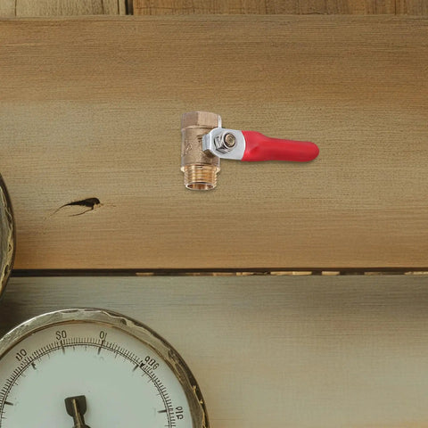 Tough As Nails Four Inch Mini Ball Valve With Slick Lever Handle and versatile male female threaded ends on a wooden background.