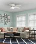 52 Inch Indoor Ceiling Fan With LED Light White Fresh Finish Low Profile Flush Mount Pull Chain Five Blades Ideal For Bedroom Or Living Room No Remote Energy Efficient Bright Lighting in living room setting.