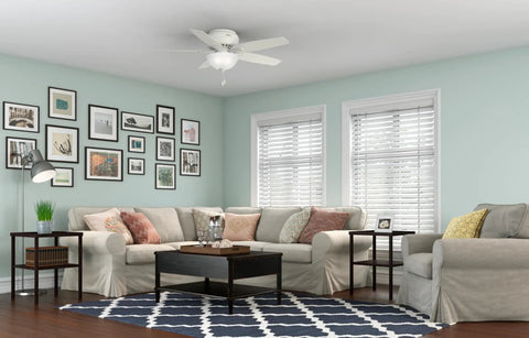 52 Inch Indoor Ceiling Fan With LED Light White Fresh Finish Low Profile Flush Mount Pull Chain Five Blades Ideal For Bedroom Or Living Room No Remote Energy Efficient Bright Lighting in living room setting.