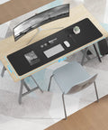 Top view of Extra Large PU Leather Desk Pad For Home Office Non Slip Waterproof Blotter Mat With Mouse Pad And Keyboard Desk Mat For Dual Screens And Two Computers 48 By 17 Inches Black, on a desk with a monitor and keyboard.