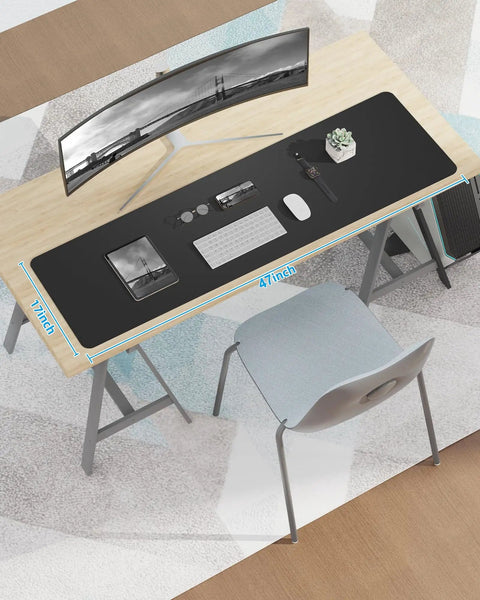 Top view of Extra Large PU Leather Desk Pad For Home Office Non Slip Waterproof Blotter Mat With Mouse Pad And Keyboard Desk Mat For Dual Screens And Two Computers 48 By 17 Inches Black, on a desk with a monitor and keyboard.