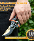 Hand holding Workhorse Ultra Sharp 8.5 Inch Bypass Pruning Shears with titanium coated SK5 steel blades in a garden setting.