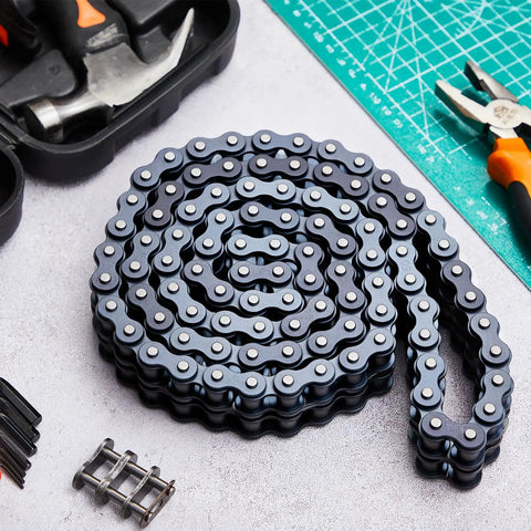 Solid 10 Foot Double Strand Roller Chain 35-2 Duplex For Gate Openers With Extra Links Easy Install And Heavy Duty Machine Gear Upgrade coiled on a work surface.