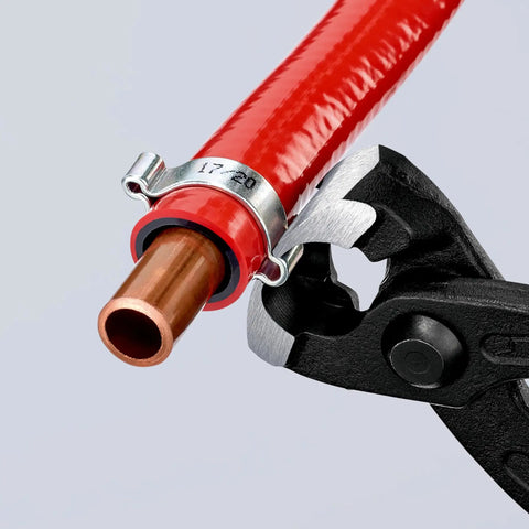 10 99 I220 Ear Clamp Pliers With Front And Side Jaws for securing a metal clamp on a red hose and copper pipe without damage to press points.