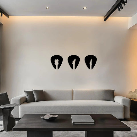 Set Of 3 Black Guitar Silhouette Wall Art On Engineered Wood 11x40 Inch Modern Wall Decor above a sofa in a living room.