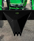 Compact Stump Bucket for Small Tractors That Delivers Max Leverage To Tackle Huge Stumps, front view mounted on green tractor