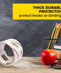 Clear Book Tape 1.5 Inch By 540 Inch One Roll for repairs and reinforcement of book covers and pages, shown with pencils and apple