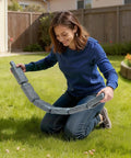 Woman arranging Faux Stone Landscape Edging Kit No Dig Border For Lawn And Garden Flexible Stone Look Edging