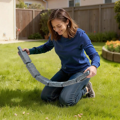 Woman arranging Faux Stone Landscape Edging Kit No Dig Border For Lawn And Garden Flexible Stone Look Edging
