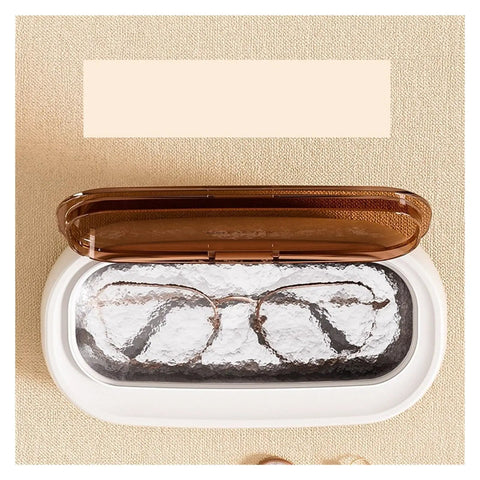 Slick Mini Ultrasonic Cleaner Doing Heavy Lifting For Jewelry And Eyewear Washing Machine Zero Sweat Compact Home Care Kit That Crushes Stubborn Buildup Grime Quickly with eyeglasses inside.