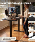Woman using 55 By 24 Inch Electric Height Adjustable Standing Desk For Home Office With Memory Preset And T Shaped Metal Bracket