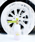 Beast Mode Heavy Duty Foam Cannon Snow Foam Lance With Quick Release Adjustable Nozzle For Car Wash Up To 3400 Psi 1 Liter Bottle in use with thick foam on car wheel