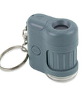 Pocket Microscope Keychain With 20x Magnification, Built-In LED And UV Light, Adjustable Focus, Portable Science Tool For Snapping Fluorescence, Inspecting Currency, Tiny Details, And Everyday Discovery On The Go. Gray plastic pocket microscope keychain with UV button and metal ring