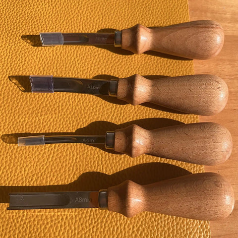 Wide Mouth Leather Edge Skiving Beveler Set Pro Grade With Six Blades Skiver Knife For Leather Craft DIY shown on leather surface.