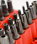 Close-up of 34-Piece Security Bit Set With One-Quarter-Inch Hex Shank For Impact Drivers, gray bits in red holder