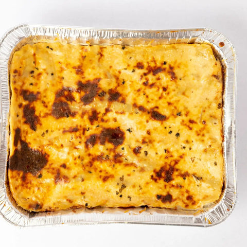 Baked lasagna in 35 Pack 8x8 Aluminum Pans With Clear Lids Square Foil Pans For Baking Heating Storing And Meal Prep Durable.