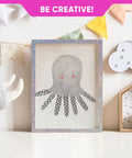 Cute octopus illustration in a sparkly holographic frame with colorful flags for creative decor inspiration