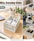 Top Shelf Foldable Storage Bins Four Pack Hella Space Savers For Tiny Apartments Dorm Rooms And Closets Easy Flat Fold Plastic Organizer Crates With Secure Lids Beige on a desk with charging accessories.