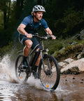 Rider on Powerful 1500W Peak Electric Bike For Adults With 80 Mile Range crossing a muddy path in the forest