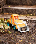 Colorful Kids Construction Bulldozer Toy With Movable Loader And Friendly Driver Durable Yellow Front End Loader Truck For Toddlers Soft Rubber Wheels Kid Friendly Classic Style For Sandbox Play Ages 18 Months And Up on dirt with rocks in loader