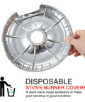 Hand holding 60 Pcs Disposable Aluminum Stove Burner Covers And Drip Pan Liners, Round 6.25 Inch, maintains stove cleanliness.