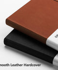 Close-up of Everyday Carry Graph Grid Paper Notebook In A5 Size With Leather Hardcover in brown and black stacked, showing texture.