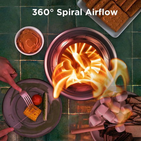 Overhead view of Cozy Tabletop Fire Pit With Stand Smokeless Outdoor Stove For Camping And Patio Use, glowing on a table with snacks.