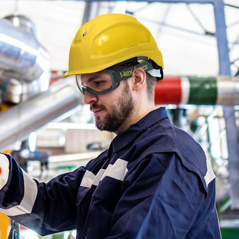 Worker wearing MX500 Safety Goggles With 23 Percent Gray Tint, Adjustable Cloth Strap, TruShield Anti Fog Coating; outdoor setting