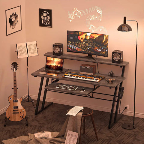 Music Studio Desk Production Workstation With Built In Power Outlet And USB Hub For Recording And Home Studio Use Studio Table For Beat Makers And Producers Grey Oak Finish in recording setup with instruments.