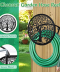 Heavy Duty Outdoor Garden Hose Reel and Wall Mount Holder With Tree of Life Metal Design, mounted with green hose outside