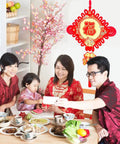 Family celebrating with Red Felt Fu Characters Hanging Ornaments For Festive Home Decor And Lucky Pendant in dining area