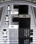 Close-up of 12V DC One Quarter Inch NPT Solenoid Air Valve, 2 Way Normally Closed, 2V025-08 Outlet Wire, on metallic surface