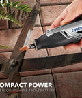 Dremel Lite cordless rotary tool with small sanding bit attached, gray and black body, side view