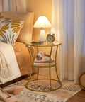 Round End Table With Charging Station And Glass Top, 2-Tier Gold Accent Side Table For Tiny Spaces next to bed with lamp and decor
