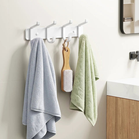 Hella Sturdy Wall Mount Coat Rack Featuring Heavy Duty Double Steel Hooks For Backpack Storage And Rust Proof Coating For Mudroom Storage That Handles Maximum Load Zero Fuss, displaying towels and a hairbrush in a bathroom.