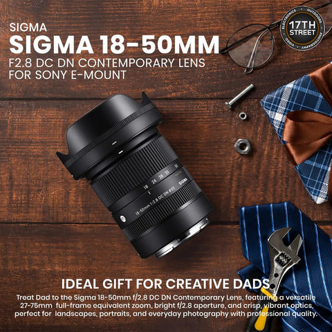 18 50mm F2.8 DC DN Contemporary Lens For Sony E Mount with camera accessories on wooden table