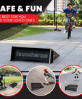 Child riding bike over Extra Wide Kids Jump Ramp For Skateboard, Scooter, Bike, BMX, RC Car And Dirt Bike 23.62 Inch Wide