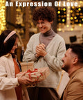 An Expression Of Love text above three people exchanging wrapped gifts at a warm indoor celebration
