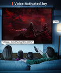 Family using Smart WiFi And Bluetooth Color Changing LED Bulbs with voice control to sync lighting with a movie scene.