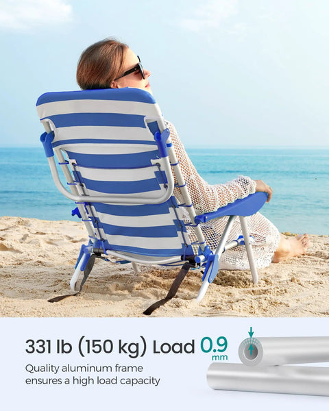 Woman seated on Backpack Beach Chair With Four Adjustable Backrest Angles, 331 Lb Capacity, Two Side Pockets And Towel Bar