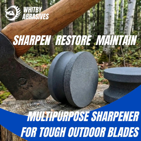4 Inch Dual Grit Pro Grade Axe And Hatchet Sharpener Silicon Carbide Stone with easy grip next to axe in forest setting.