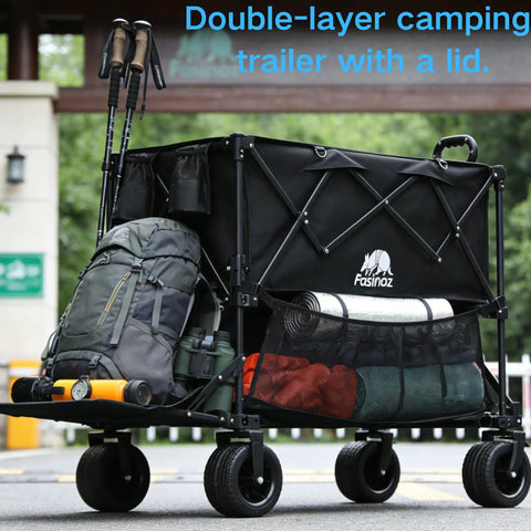 Double-layer camping trailer with a lid loaded with gear outdoors, featuring black frame and mesh pockets for storage.