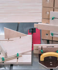 Matchfit Dovetail Clamps 2 Pack With Hardware Pack For Dovetail Grooves And One Half Inch 14 Degree Router Bit Profiles shown installed on grooved workbench.