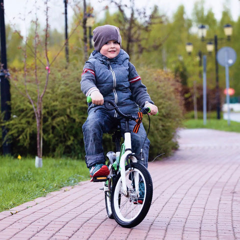 Child riding a bicycle fitted with Heavy Duty 16 Inch Bike Inner Tubes 16x1.75 16x1.90 16x2.10 16x2.125 AV Schrader Valve
