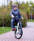 Child riding a bicycle equipped with Two-Pack Tough As Nails Heavy Duty Bike Inner Tubes 16x2.10/2.50 With AV32mm Schrader Valve