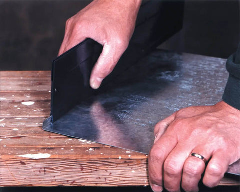 Hands using 24 Inch Sheet Metal Folding Tool For HVAC Pros Steel Bender With Two Throat Depth Settings Three Eighths Inch And One Inch Made In USA